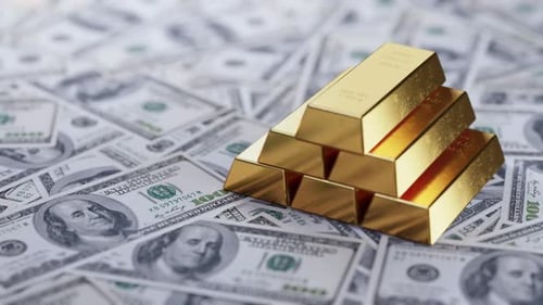 Gold Bars on Dollar Bills Background