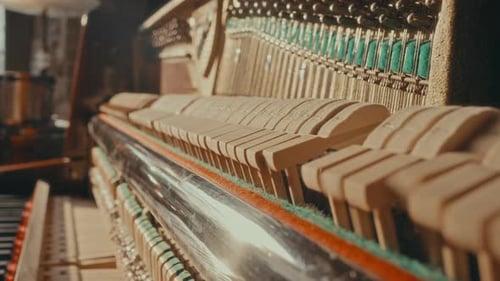 Close-Up of Piano Hammers in Motion during Music Performance