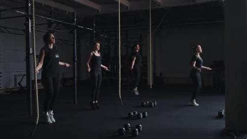 Group Fitness Classes In Health Club Women Skipping Rope Training Together In Gym Active Sport