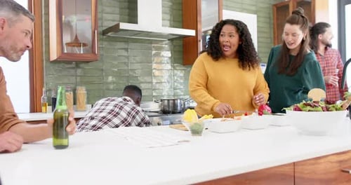 Friends Cooking Together in Modern Kitchen