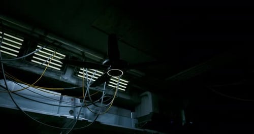 Futuristic Industrial Room with Spinning Ceiling Fan