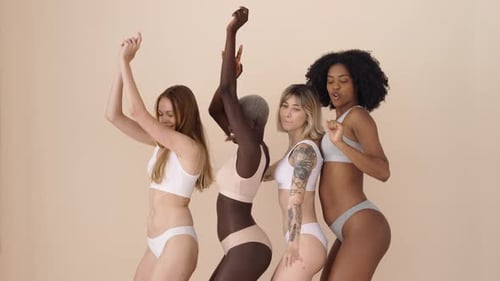 Women in Lingerie Dancing Together
