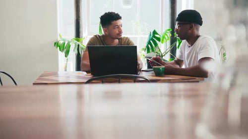 Business people, computer and coffee shop meeting, planning and talking of startup ideas