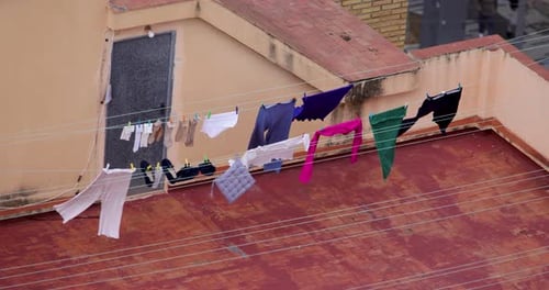 Laundry Drying on Clothesline in Urban Rooftop Setting