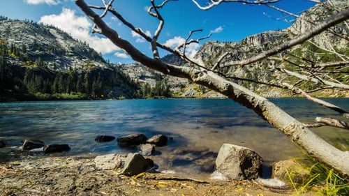 Motion time lapse of a mountain lake in the fall.