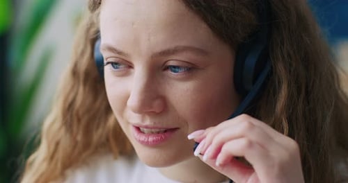 Close Up of Woman Corporate Operator Working in Support Service Speaking on Video Call Using Laptop