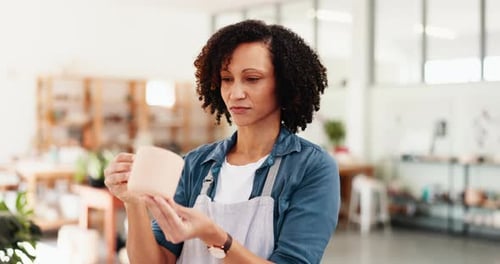 Woman, workshop and inspection with mug, inventory and product manufacturing process