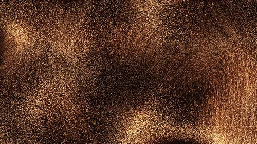 Particules dorées brillantes sur fond sombre