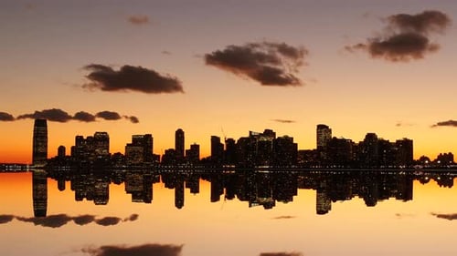 City Skyline at Sunset Reflecting on Water