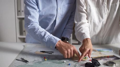 Couple Planning Exciting Travel Adventure With Map