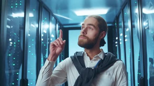 Man Working in Data Center with Laptop