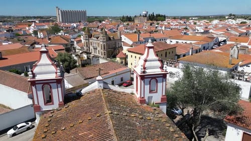 Beautiful old town, drone passes by the church towers.