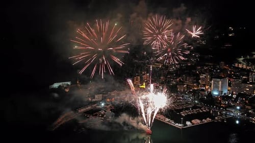 Fireworks with colorful lights over sea