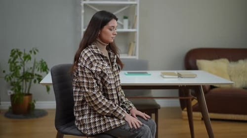 Side View Young Beautiful Worried Woman Sitting in Psychologist Office Waiting