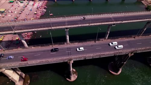 vehicles moving on Bridge with narmada river and farming lands at Jotpur, Jabalpur, madhya pradesh,