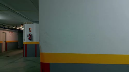 Modern empty factory corridor illuminated by led lamps in red gray and yellow