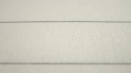 "Sharp Pull Focus on Lined Notepad Texture. Probe lens