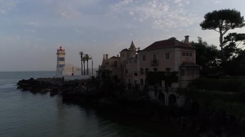 Coastal scene with Casa de Santa Maria and Lighthouse in Cascais, Portugal