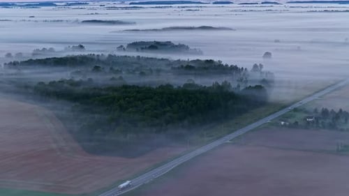 A Tranquil Aerial View of Foggy Landscape at Dawn