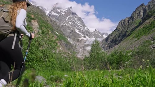 Woman Hiking in Mountains with Backpack Female Hiker Walks on Trail in National Park Girl Explores