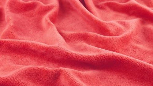 Soft folds of natural velvet strawberry shades of pink. Textile background on the theme design