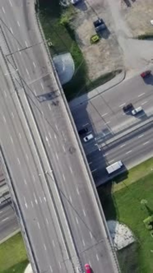 An Aerial View Capturing the Busy Highway Interchange in a Thriving City Landscape Stock Clip