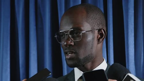 Adult Speaking at Press Conference Close Up