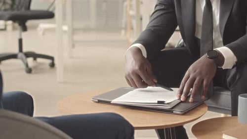 Business Meeting and Agreement with Handshake in Office