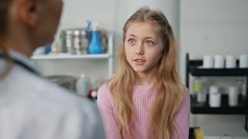 Cute Girl Visiting Doctor in Childcare Clinic Closeup Pediatrician Talking Kid