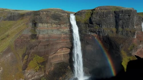 Haifoss Waterfall With Rainbow In Summer In Iceland. - aerial shot