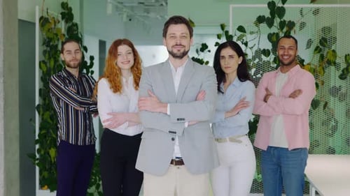 Confident Business Team Poses with Arms Crossed