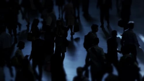 Silhouettes of Many People Walking in Urban Setting