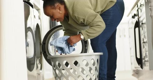 Woman Doing Laundry in Her Laundry Room
