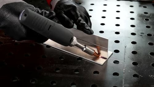Welding Metal Details in Workshop of Industry Plants Closeup View of Male Hands