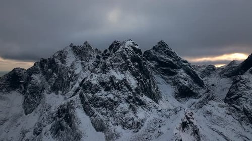 Mesmerizing Aerial Footage Reveals a Snowcapped Nordic Mountain Range on a Cold Winter Day