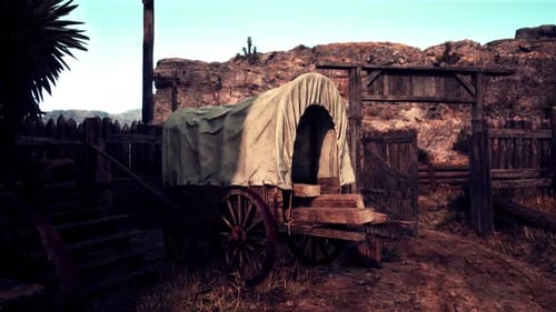 A Vintage Covered Wagon on a Rustic Dirt Road