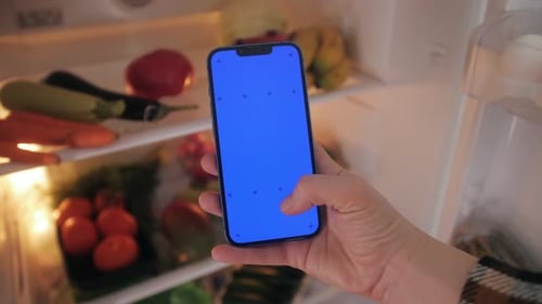 Hand Taps Chroma Key Phone in Refrigerator