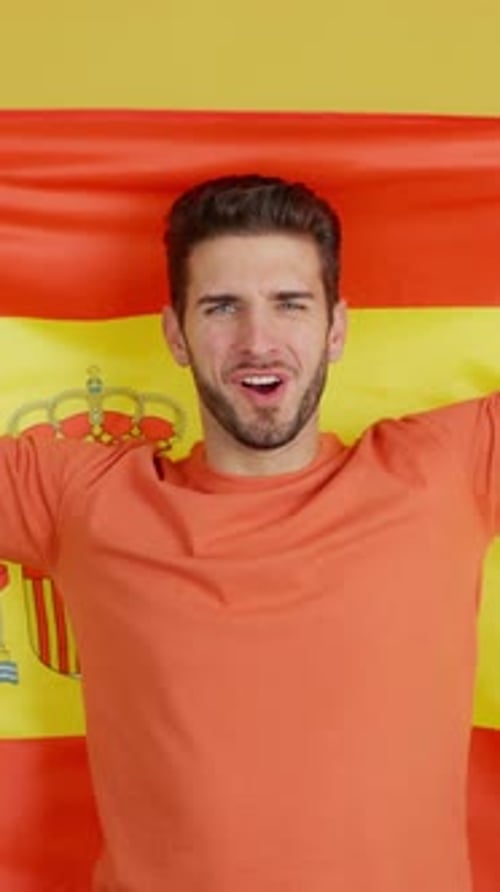 Smiling Man Holds Spanish Flag Portrait