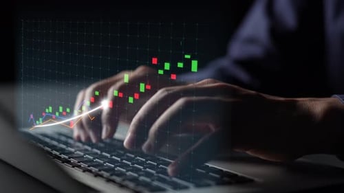 Dynamic Financial Growth Concept with Hands Typing on Keyboard and Graphs Representing Rising Trends