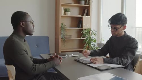 Two Men Meeting in Workplace Office Space