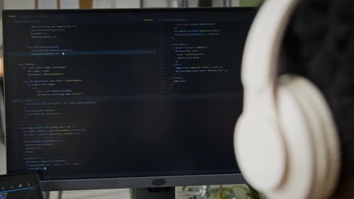 Black Male Software Engineer Watching AI Vibe Coding Agent Writing Script