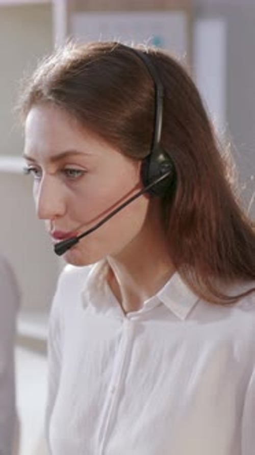 A Professional Female Call Center Operator Thriving in a Modern Office Environment
