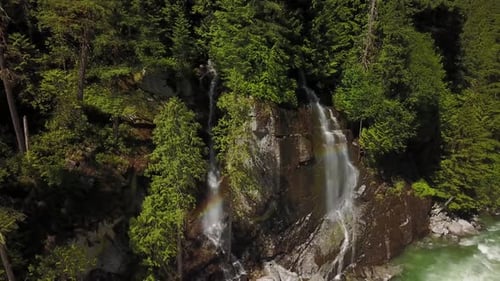 River Current Flowing in the Valley Around the Smooth Rocks During a Bright Sunny Spring Day