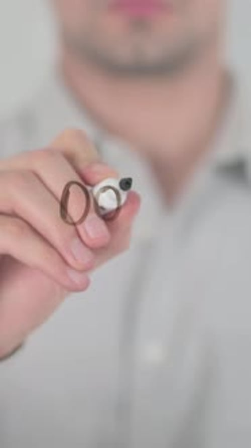 Man Writes "Down Payment" on Glass Surface