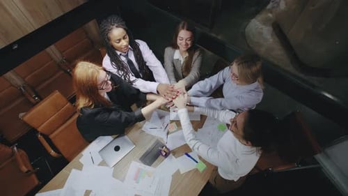 Successful Team Celebrates at Meeting in Office