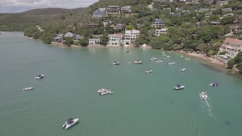 Aerial View Of Tropical Bay With Boats Near Coastal Town