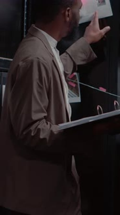 Focused Businessman Reviewing Documents in Office