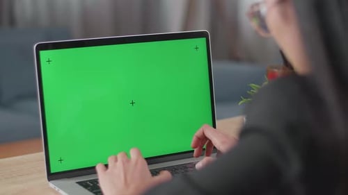 Close Up Of Asian Businesswoman Typing On Green Screen Computer While Working