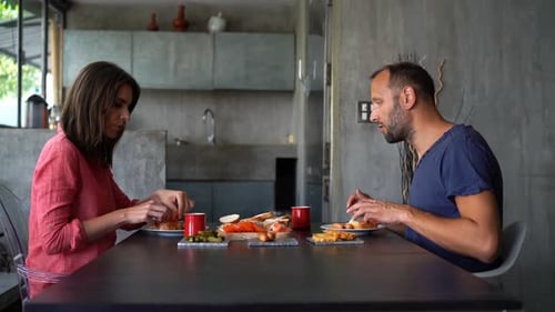 Couple enjoying breakfast at the table