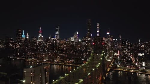 Aerial Views Capture the Illuminated Queensboro Bridge Alongside the Breathtaking Manhattan Skyline